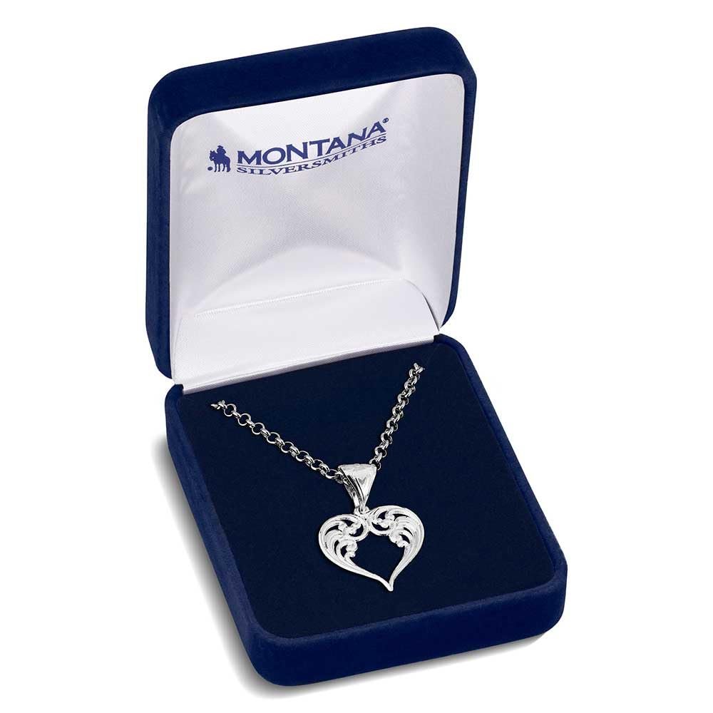 
                  
                    Silver heart-shaped pendant necklace in a Montana Silversmiths box on a white background
                  
                