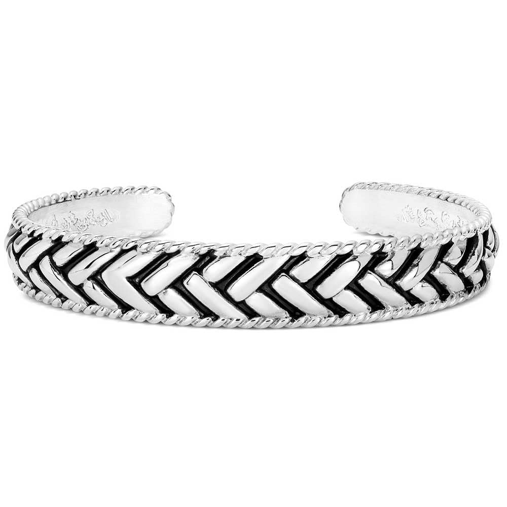 Silver bracelet with a chevron pattern on a white background