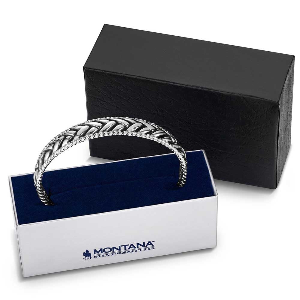 
                  
                    Silver bracelet in a Montana Silversmiths box on a white background
                  
                