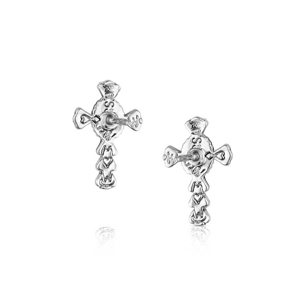 
                  
                    Pair of silver cross-shaped earrings on a white background
                  
                
