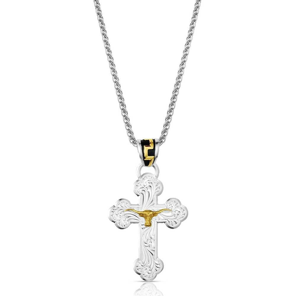 Silver and gold cross pendant on a chain against a white background