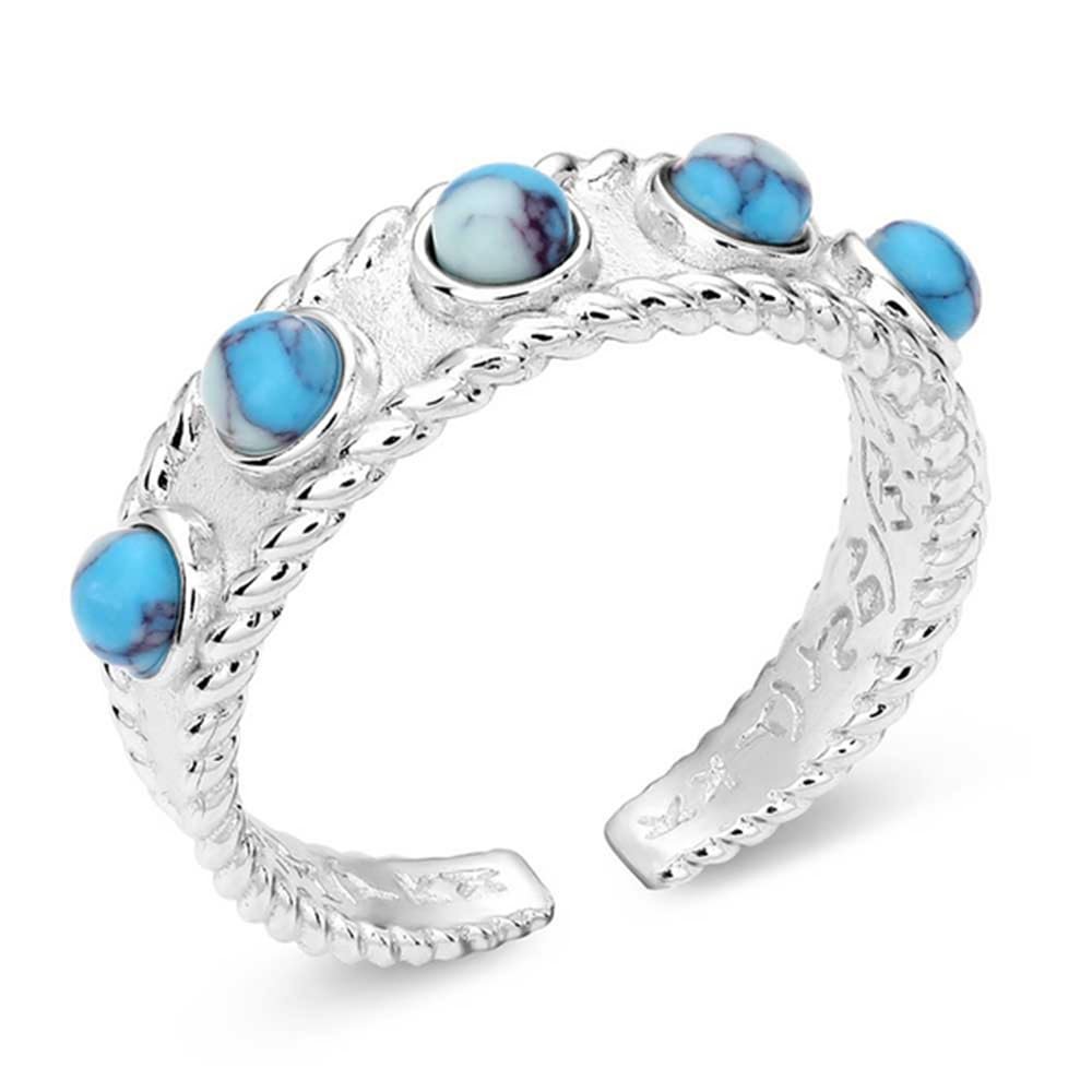 
                  
                    Silver ring with turquoise stones on a white background
                  
                