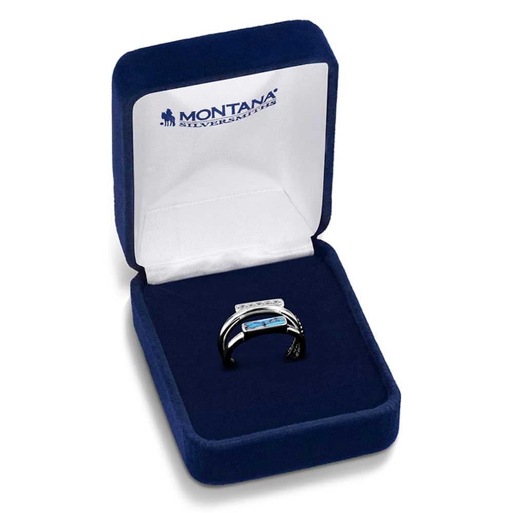 
                  
                    Silver ring with blue gemstone in a Montana Silversmiths box on a white background
                  
                