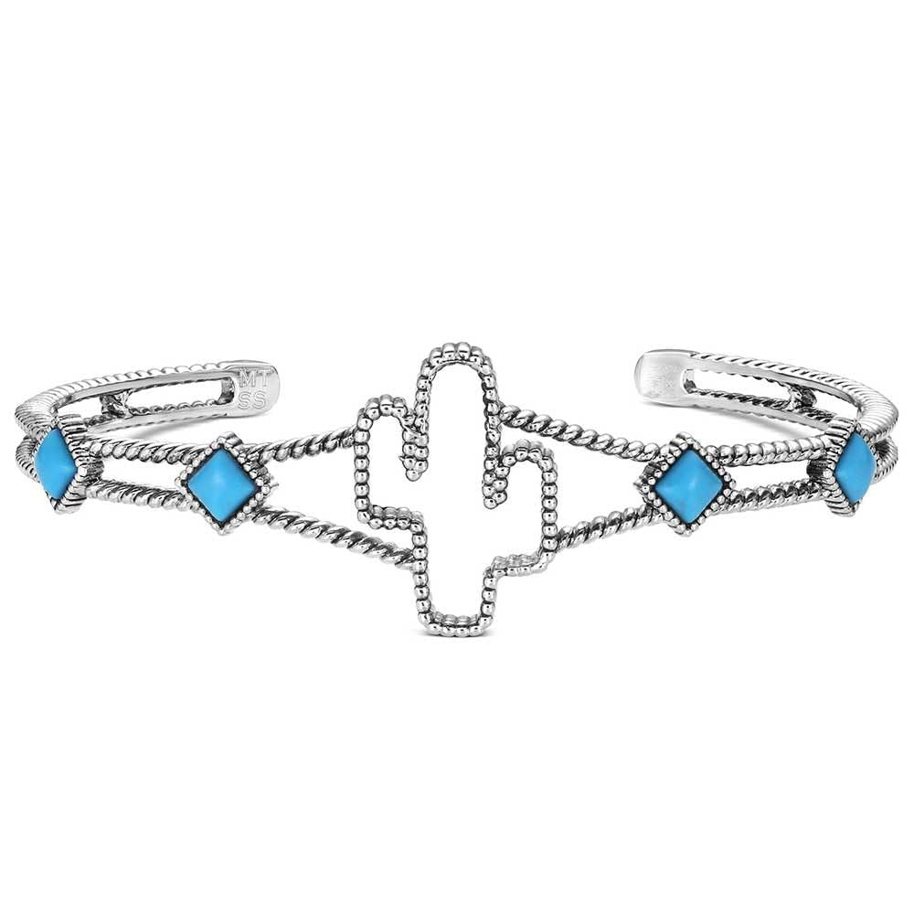 Silver bracelet with cactus design and blue gemstones on a white background