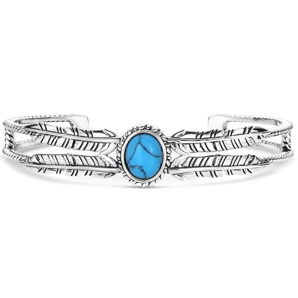 Silver bracelet with a blue stone on a white background