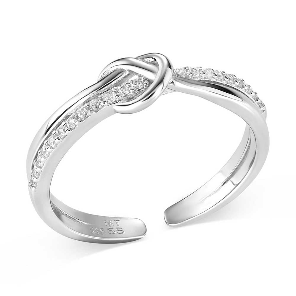 Silver ring with diamond accents on a white background