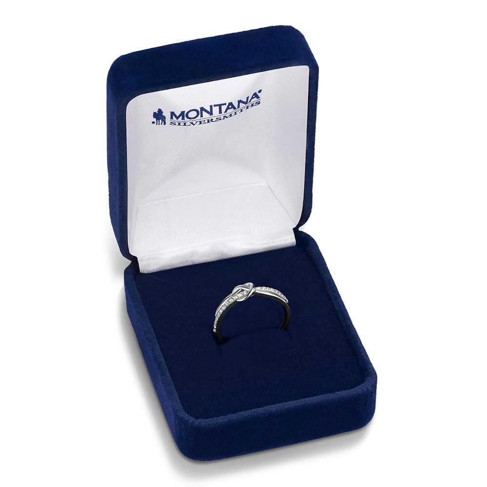 
                  
                    Diamond ring in a blue velvet box with 'Montana Silversmiths' branding on a white background
                  
                