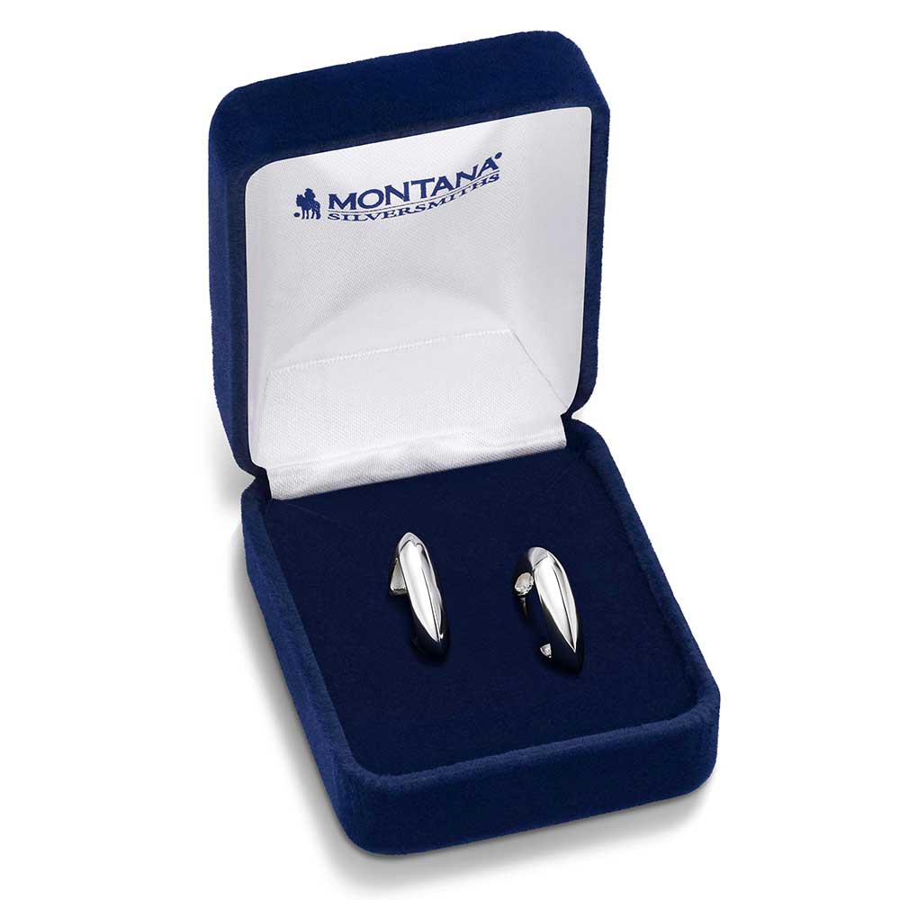 Silver earrings in a blue velvet box with 'Montana Silversmiths' branding.