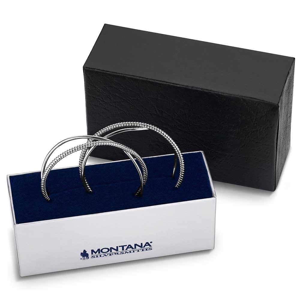 Two silver bracelets in a Montana Silversmiths box with a black background