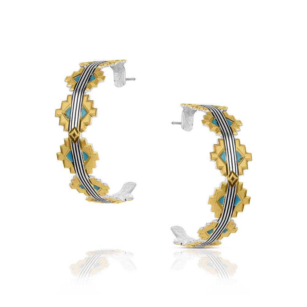 Pair of hoop earrings with gold and silver design on a white background
