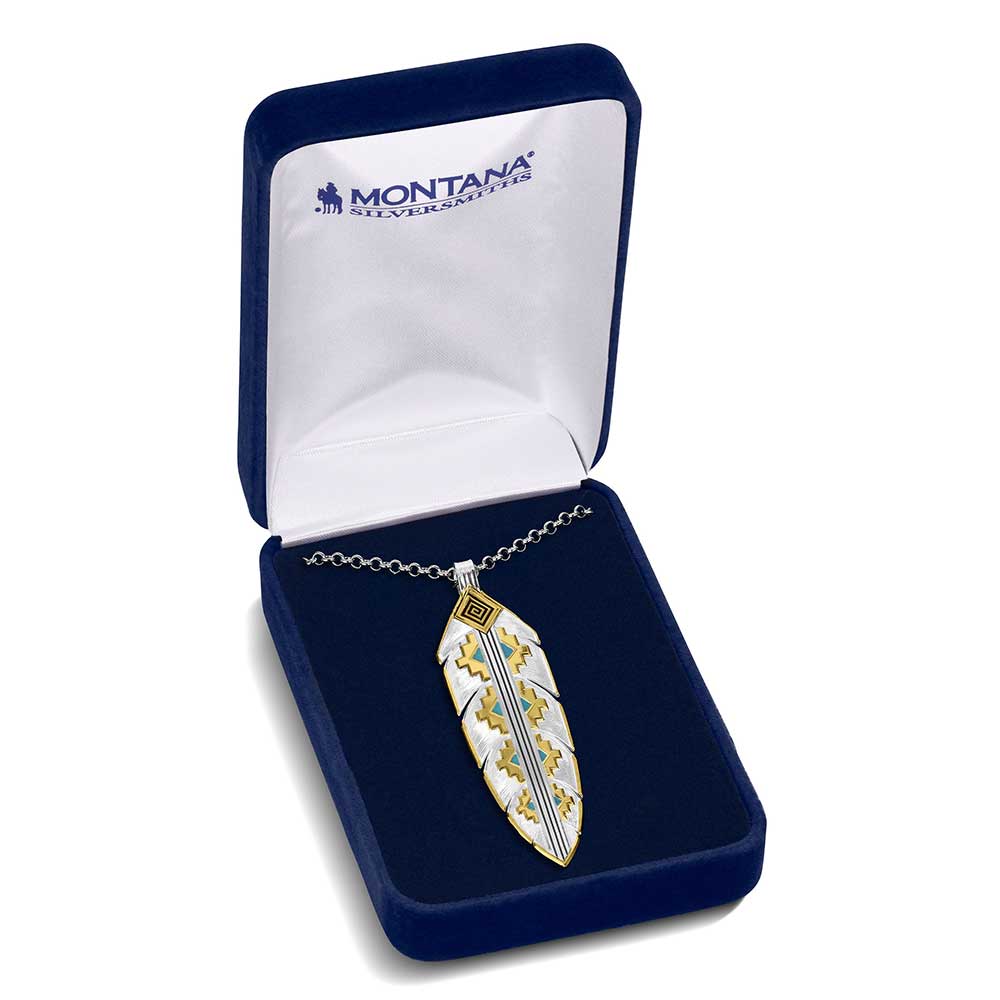 
                  
                    Feather-shaped pendant in a blue Montana Silversmiths box on a white background
                  
                