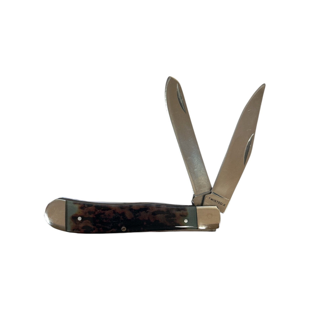 Trapper knife with a tortoiseshell handle on a white background