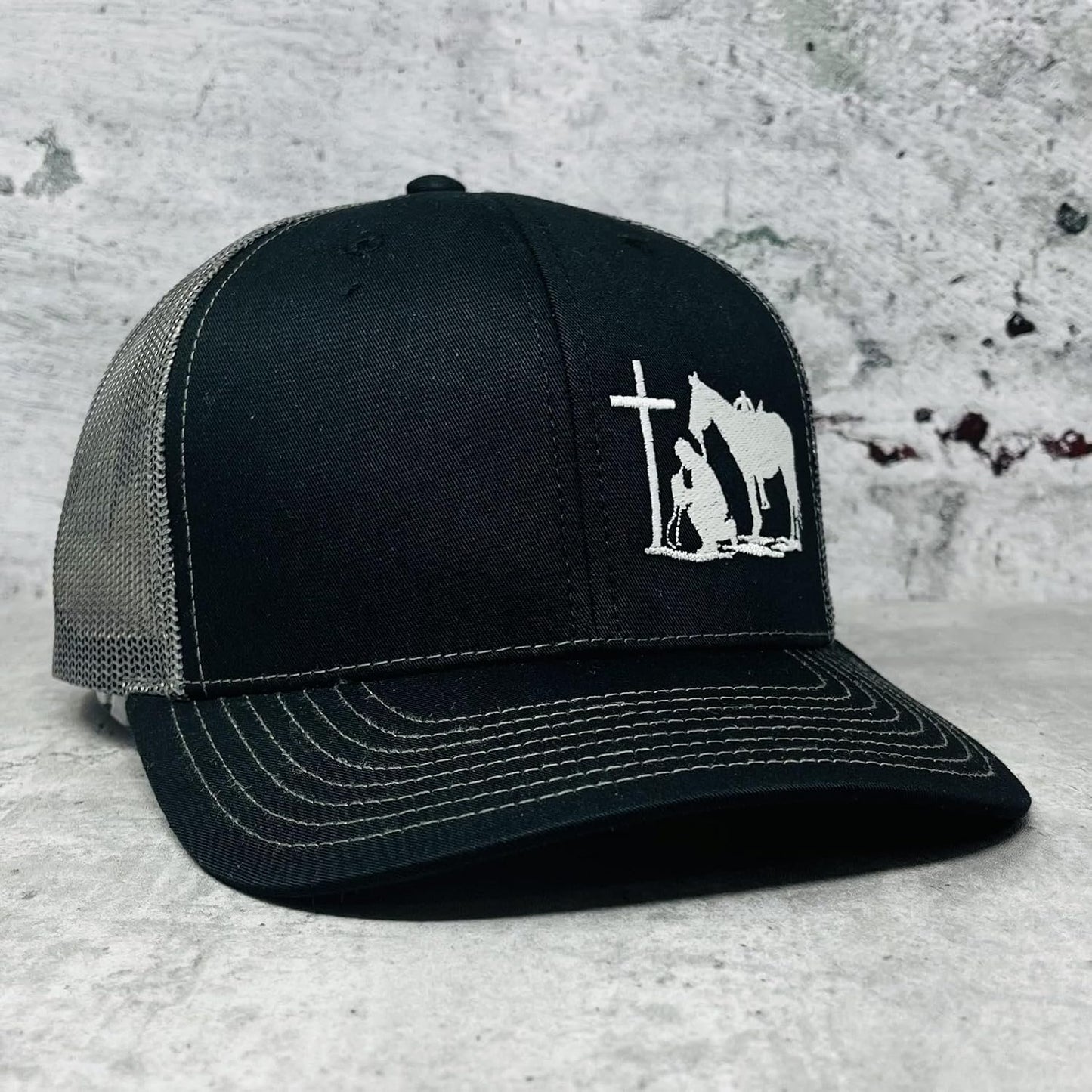 Front view of the DALLY Up Christian Praying Cowboy Patch Western trucker hat with embroidered front patch and adjustable snapback.