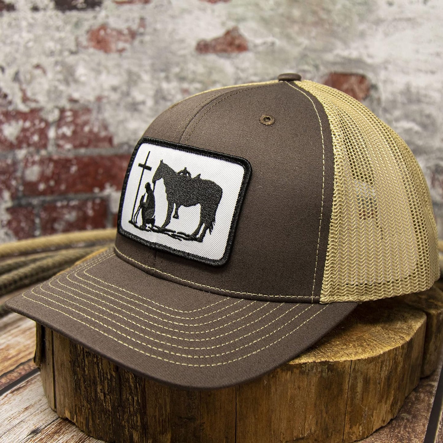 Front view of the DALLY Up Christian Praying Cowboy Western snapback hat in brown and tan with oversized embroidered patch.