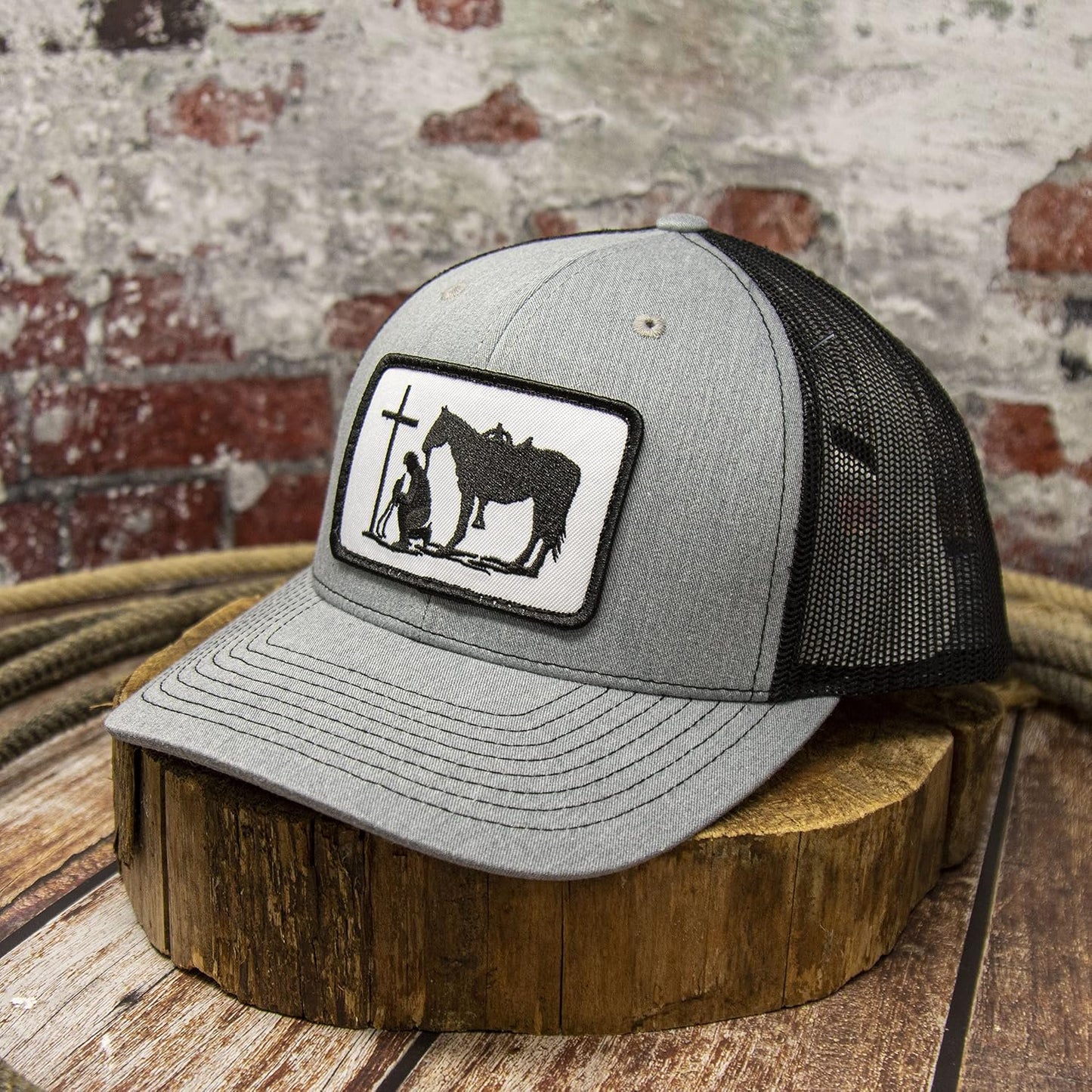 Front view of the DALLY Up Christian Praying Cowboy Western snapback hat in heather gray and black with oversized embroidered patch.
