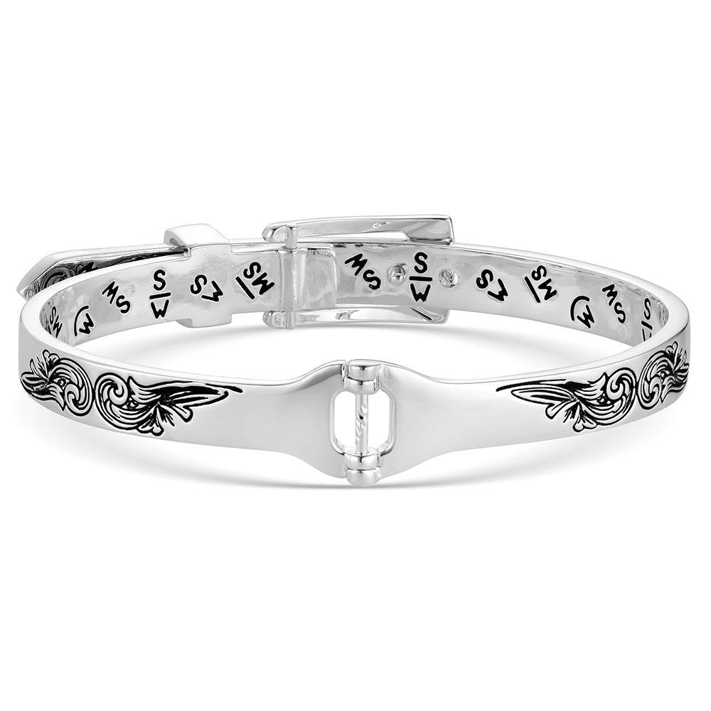 Engraved silver Western buckle bracelet by Montana Silversmiths with intricate scrollwork and timeless cowgirl design.