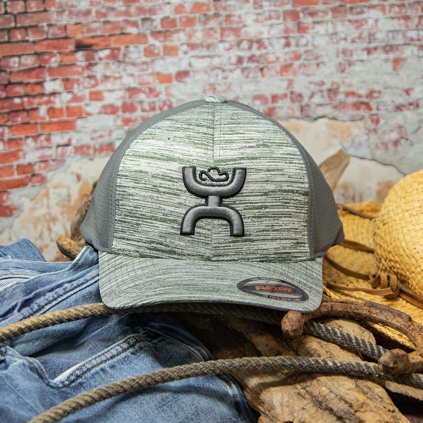 Cowboy Wearing HOOEY Ash Flexfit Fitted Hat Grey on Ranch