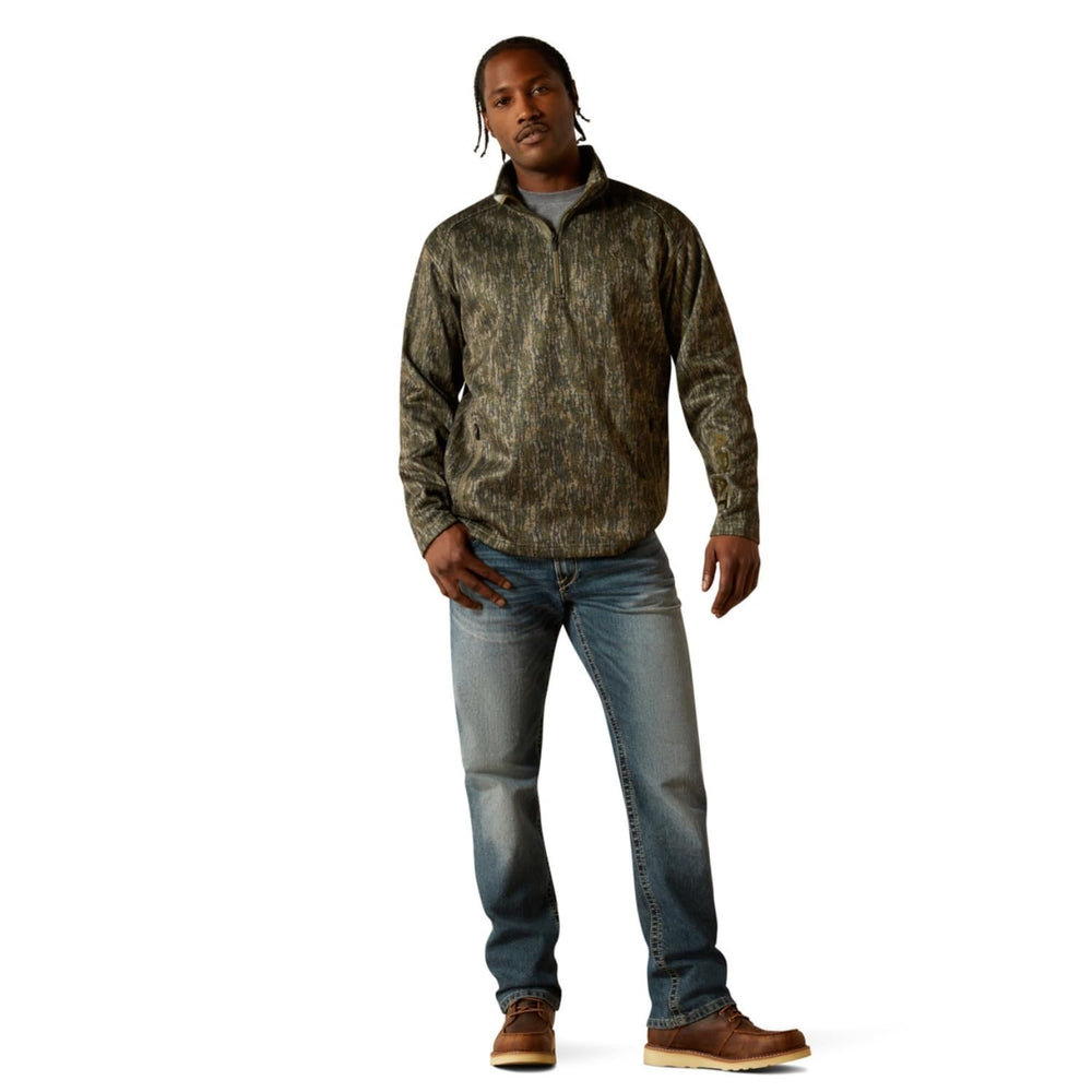 
                  
                    Man wearing Ariat Men's Caldwell 1/4 Zip Sweater in Green Treebark Camo
                  
                
