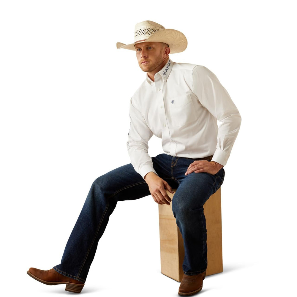 
                  
                    Man Wearing Ariat Men's Team Logo Twill Classic Fit Shirt, Sitting Down
                  
                