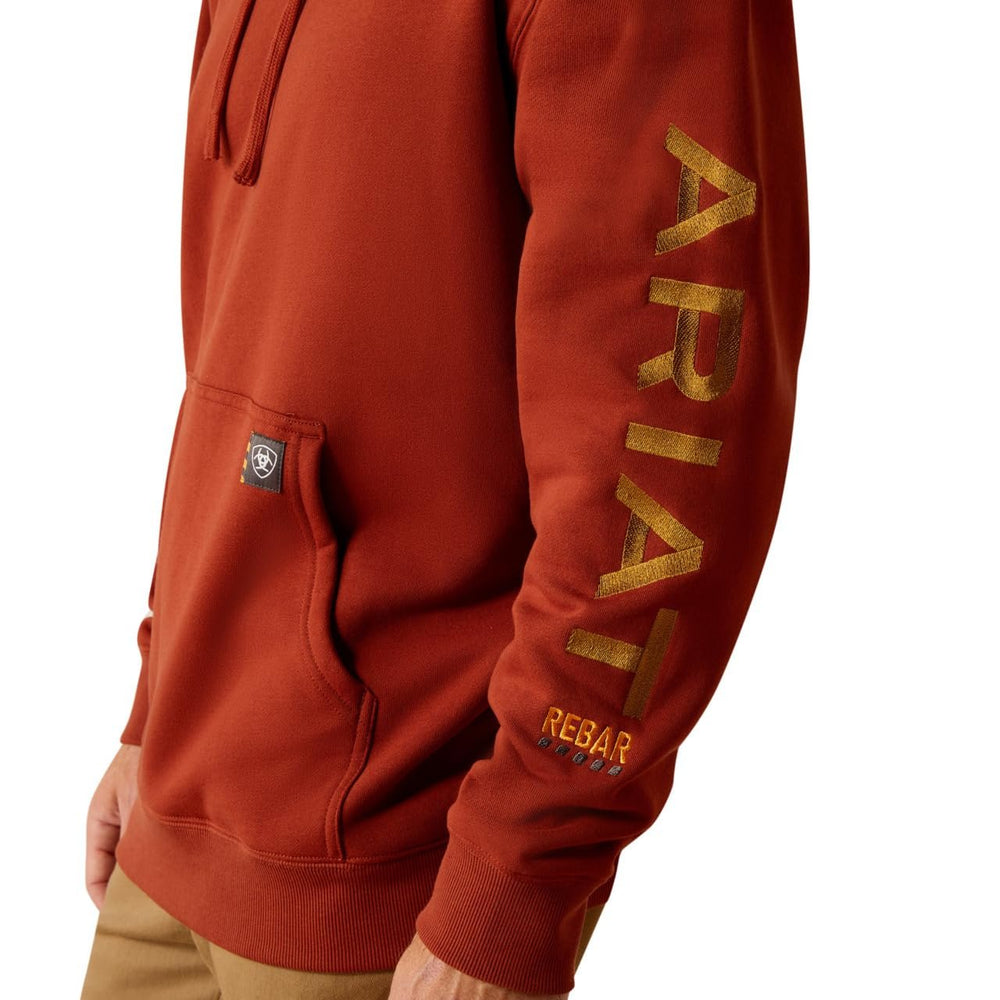 
                  
                    Logo on Sleeve of Ariat Men's Rebar Graphic Hoodie in Burnt Henna/Cumin
                  
                