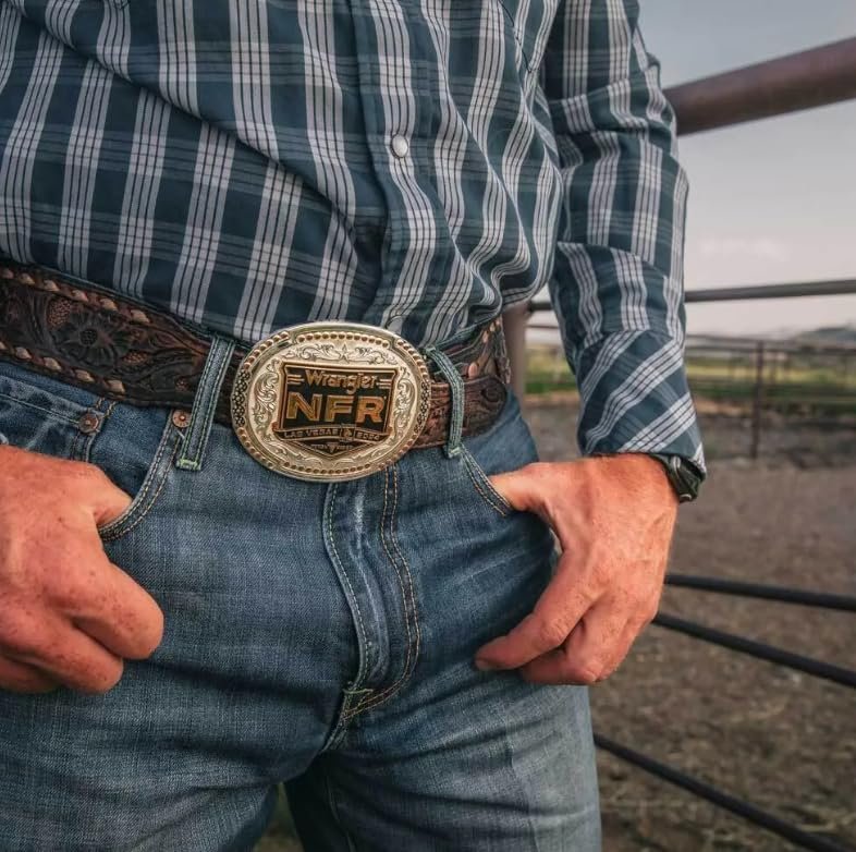 
                  
                    Man wearing the 2024 NFR Western Belt Buckle – A cowboy in blue jeans and a plaid shirt, proudly showcasing the NFR belt buckle on a tooled leather belt.

                  
                