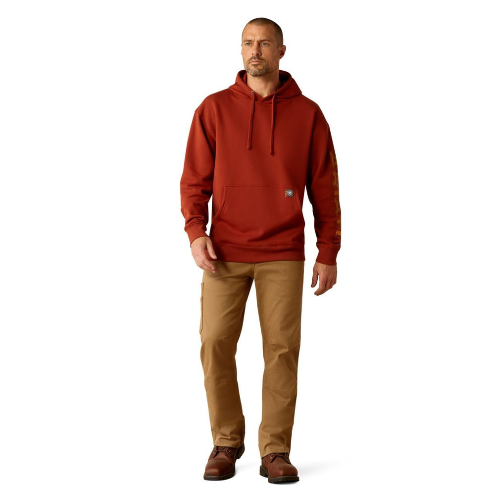 
                  
                    Man Wearing Ariat Men's Rebar Graphic Hoodie in Burnt Henna/Cumin
                  
                