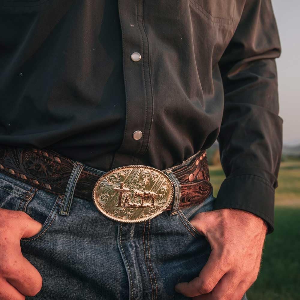 
                  
                    Man Wearing Montana Silversmiths Striking Engraved Belt Buckle With Christian Cowboy
                  
                