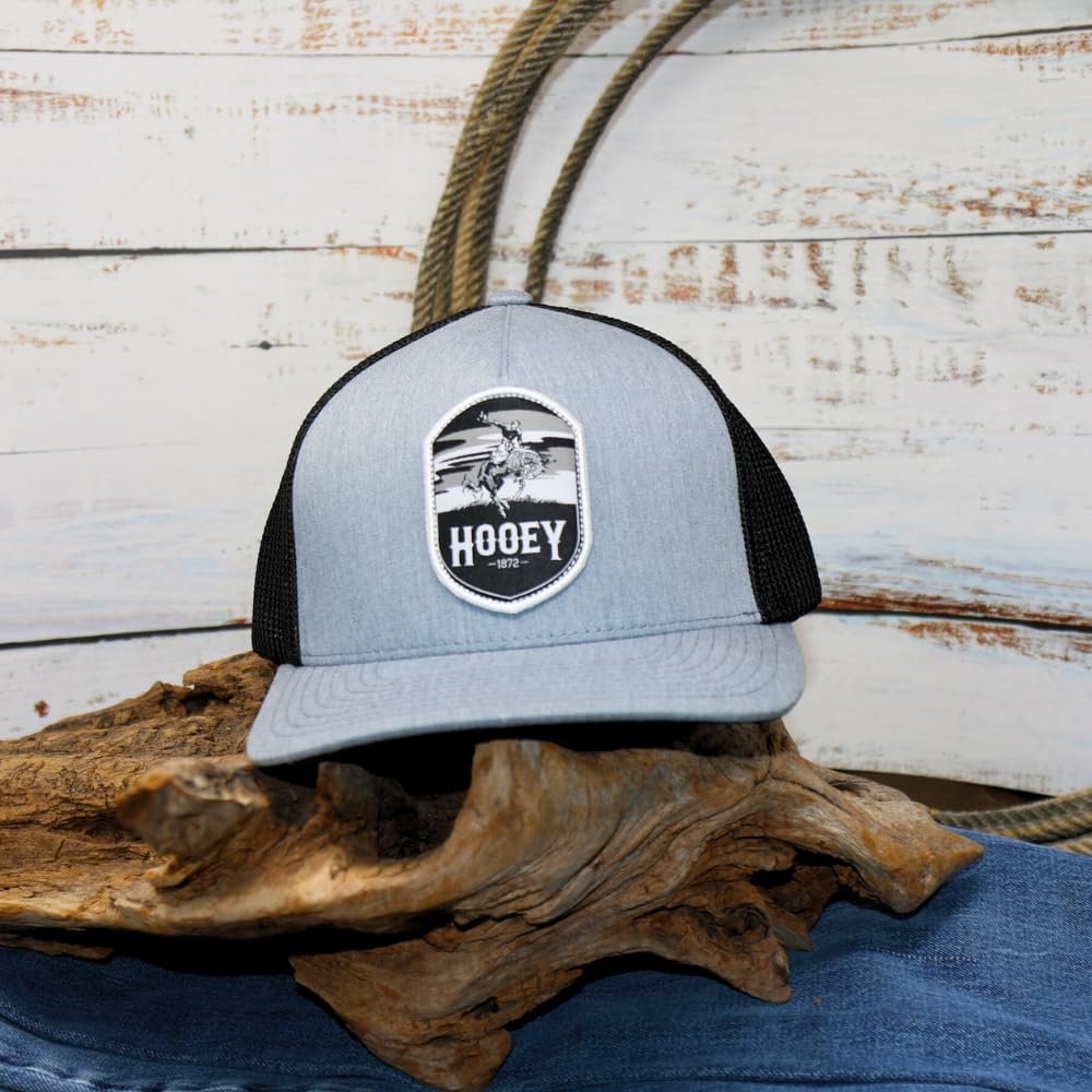 
                  
                    Gray and black cap with 'HOOey' logo on a wooden surface
                  
                