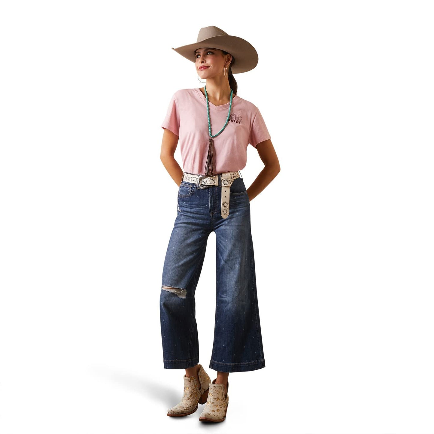 Cowgirl Wearing Ariat Women's Real Grazin' T-Shirt in Coral Blush