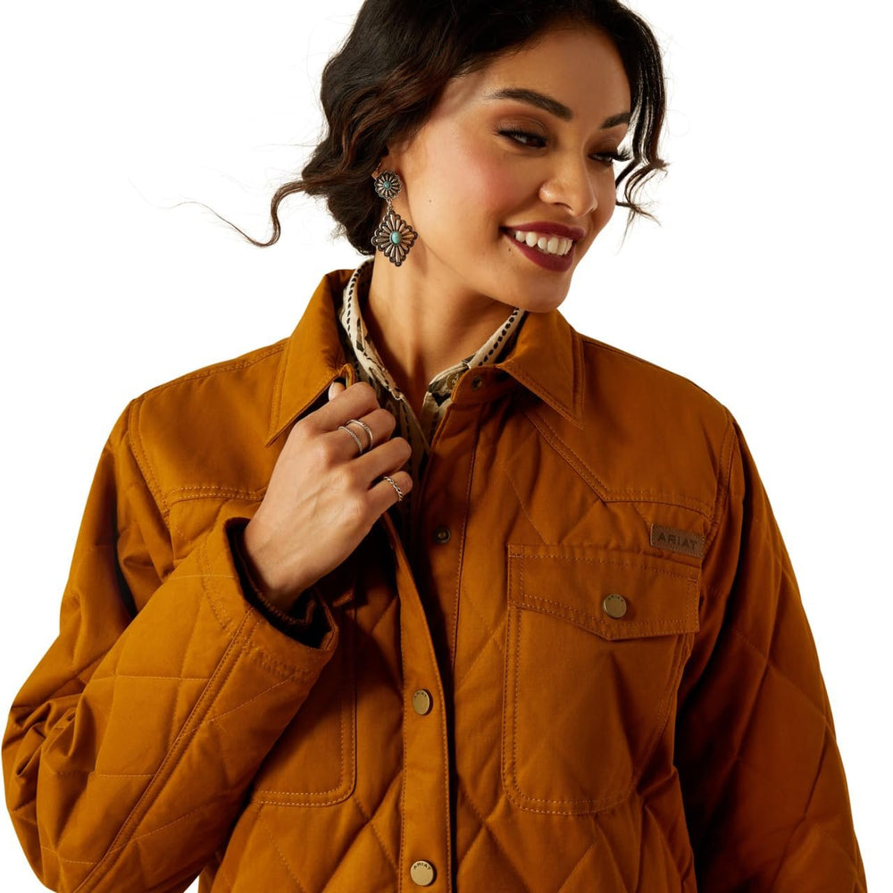 
                  
                    Close-up of Ariat Women's Grizzly Quilted Barn Jacket in Chestnut Horse
                  
                