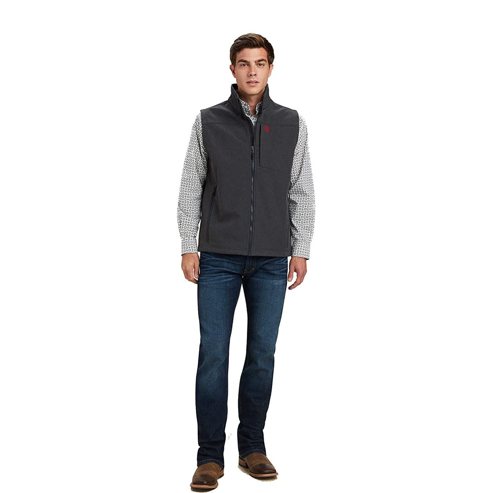 Man Wearing Ariat Men's Logo 2.0 Softshell Vest in Charcoal/Americana
