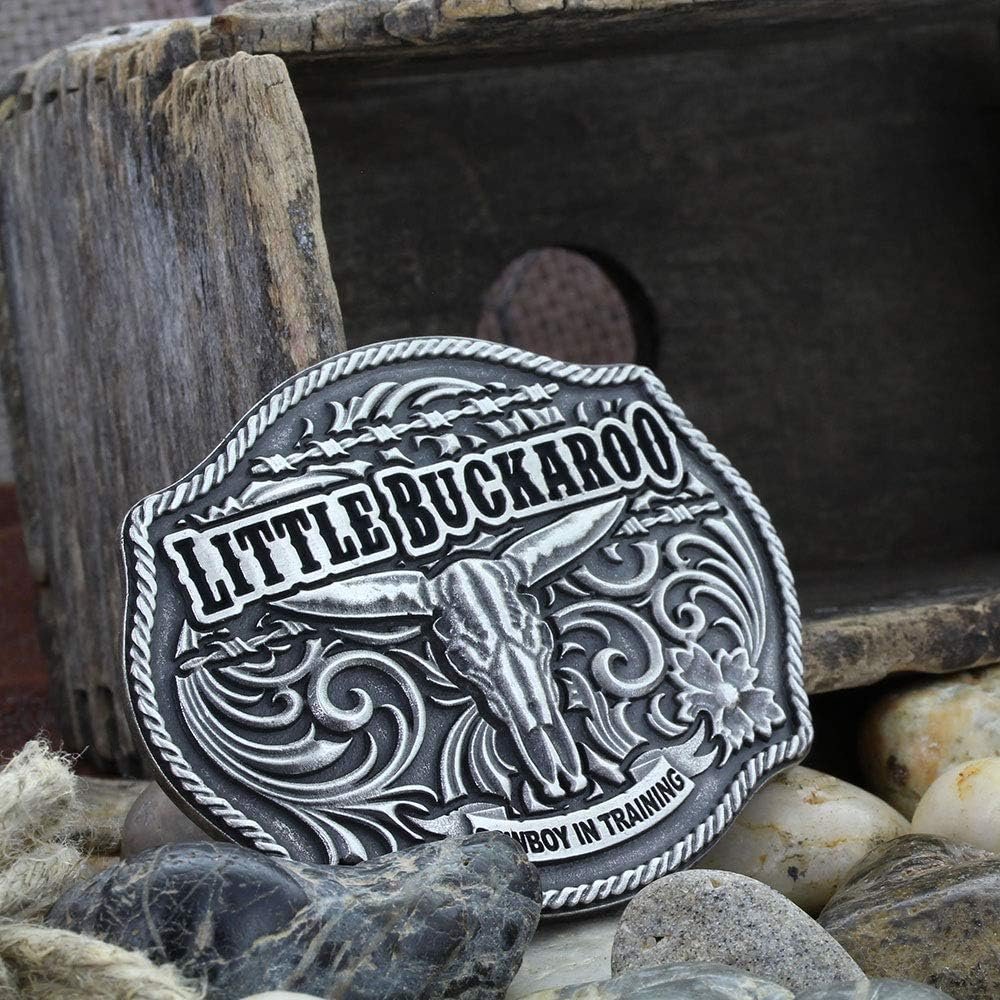 
                  
                    Montana Silversmiths Classic Impressions Lil Buckaroo Skull Kids Attitude Buckle Against Rustic Background With Wood and Stones
                  
                