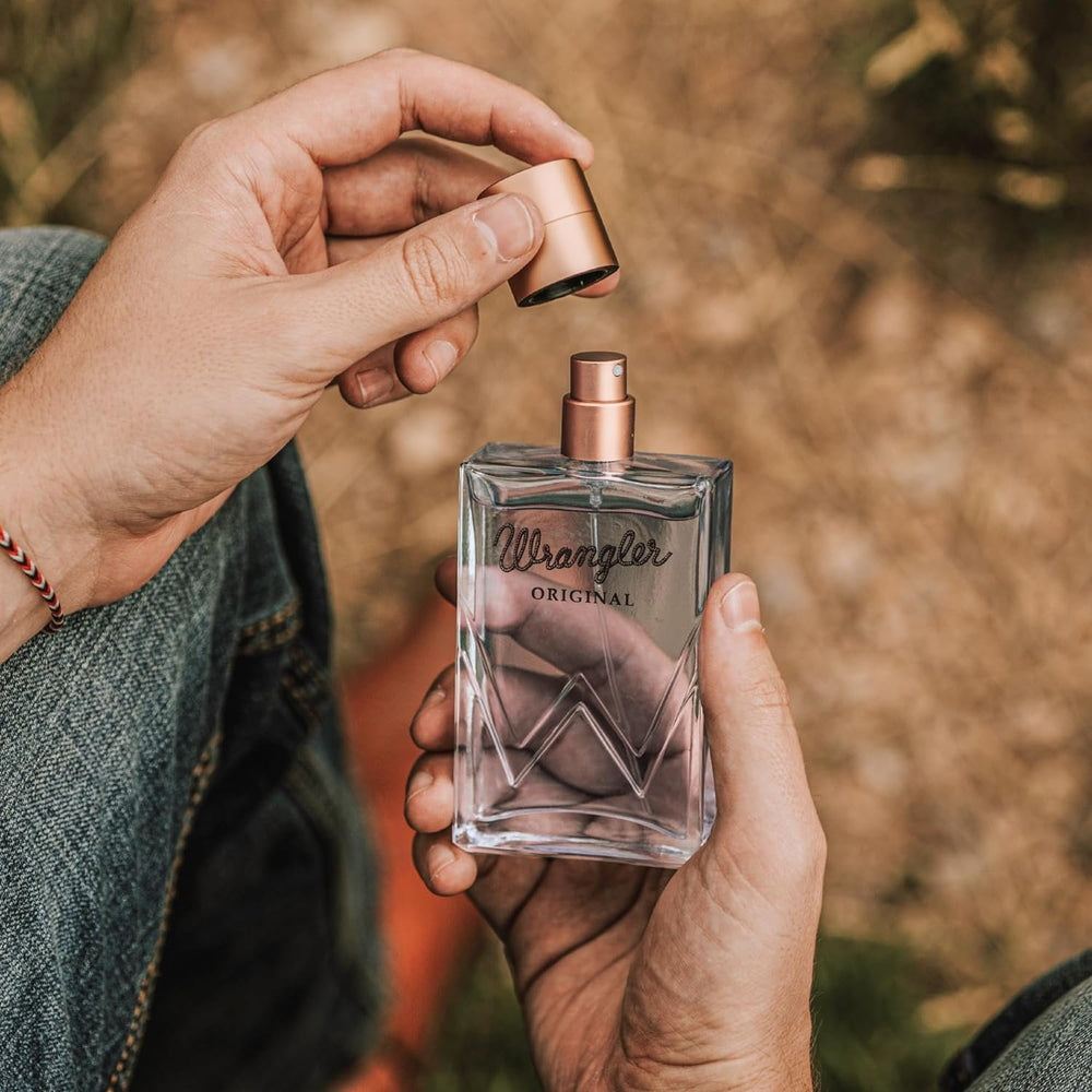 
                  
                    Man Opening Bottle of Wrangler Original Cologne For Him by Tru Western
                  
                