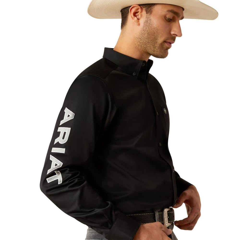
                  
                    Side Profile of Man Wearing Ariat Men's Team Logo Twill Classic Fit Shirt in Black/Grey
                  
                