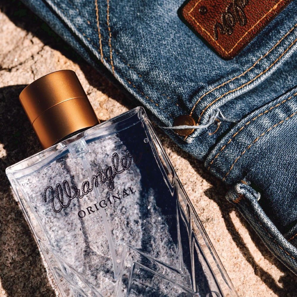 
                  
                    Wrangler Original Cologne For Him by Tru Western Bottle Beside Denim
                  
                
