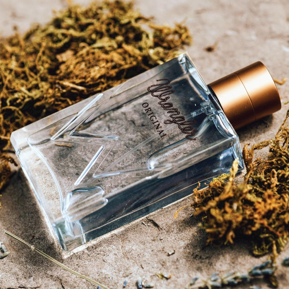 
                  
                    Wrangler Original Cologne For Him by Tru Western Bottle on the Ground
                  
                