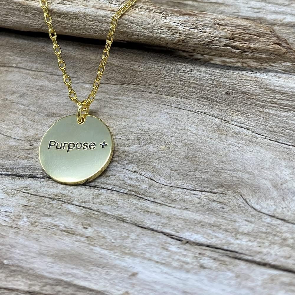 
                  
                    Montana Silversmiths Women's Purpose More Faith Pendant Necklace Against Wooden Background
                  
                