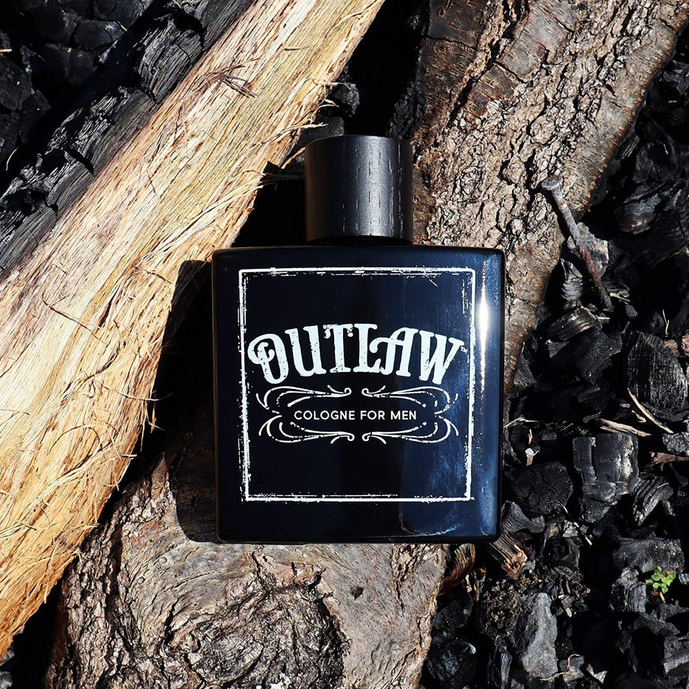 
                  
                    Tru Western Men's Outlaw Cologne Against Rustic Background
                  
                