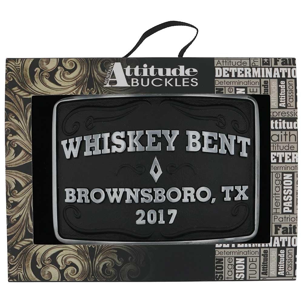 
                  
                    Brownsboro Whiskey Bent Belt Buckle in packaging – The Western belt buckle displayed in a Montana Silversmiths "Attitude Buckles" gift box, featuring gold detailing and branding.

                  
                