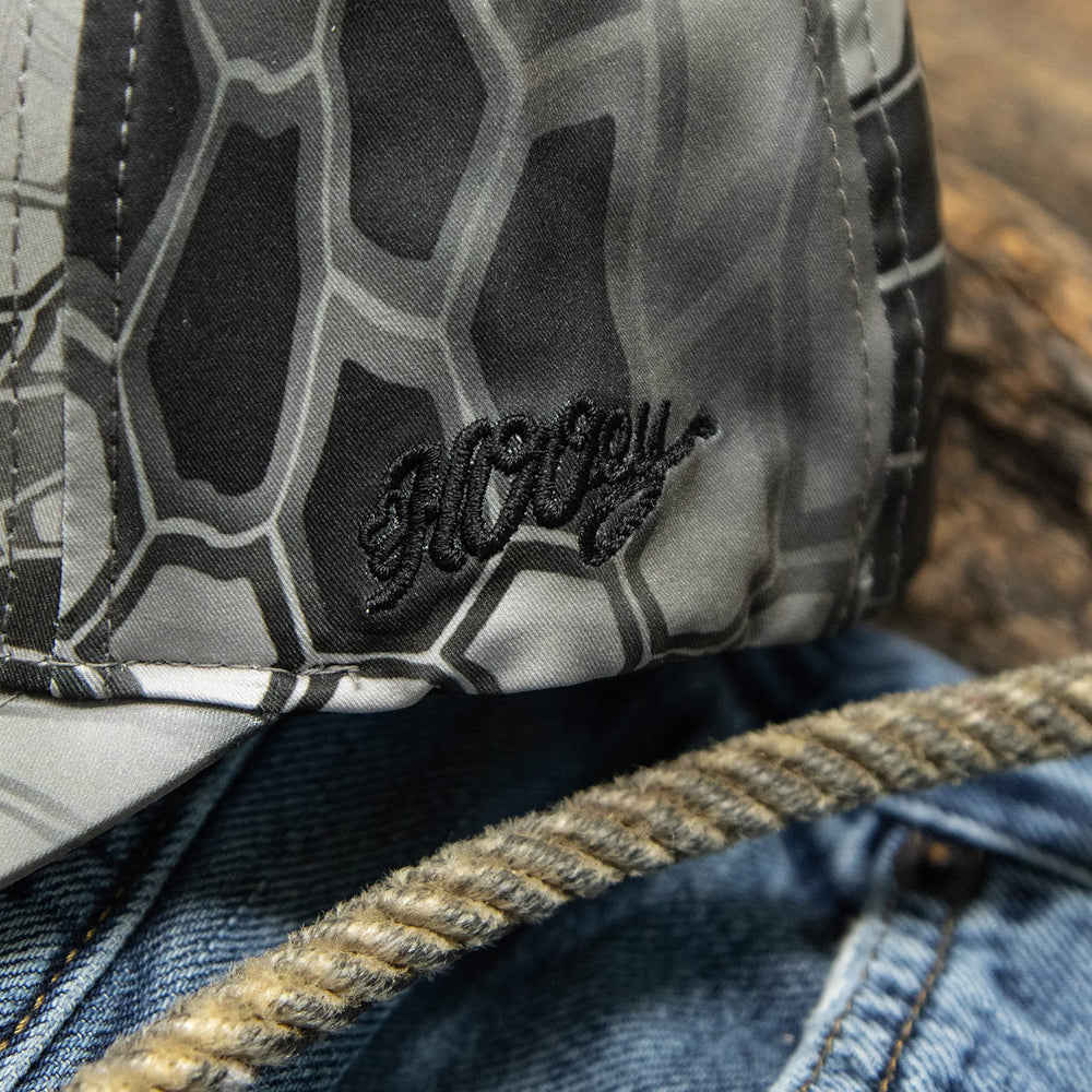 
                  
                    Close-up of logo on Hooey Men's Chris Kyle Flexfit Fitted Hat, Grey Camo, Large/X-Large
                  
                