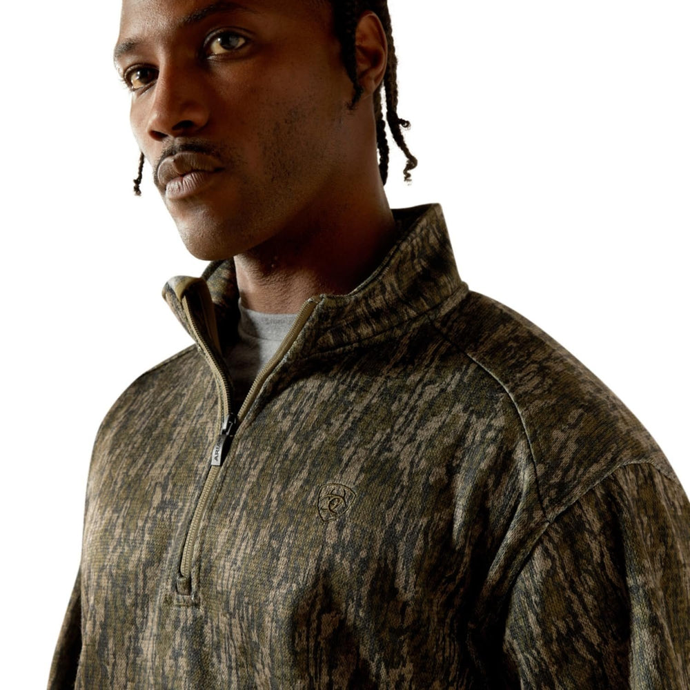 
                  
                    Close-up of collar and logo detail on Ariat Men's Caldwell 1/4 Zip Sweater in Green Treebark Camo
                  
                