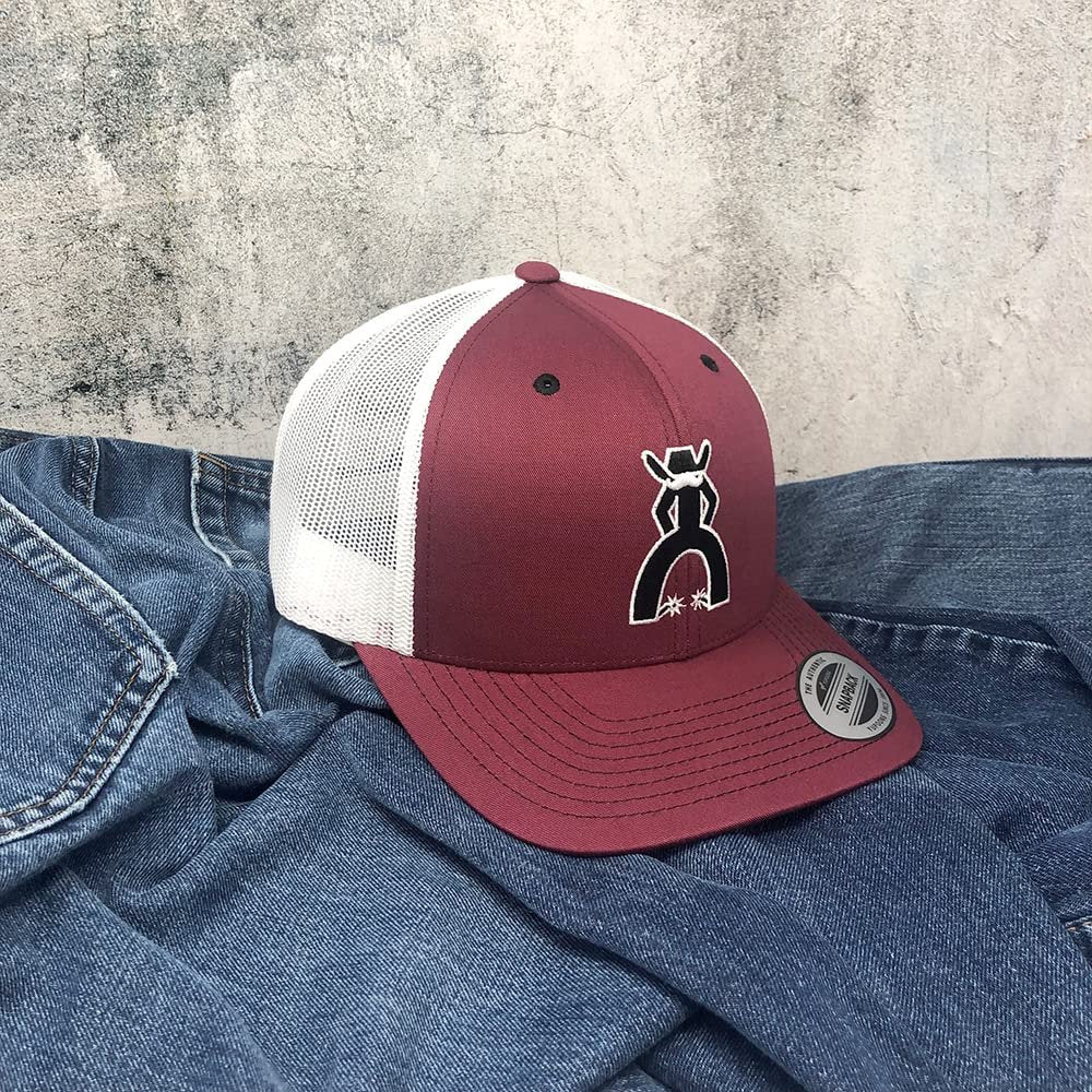 
                  
                    Maroon and white cap with a logo on a denim surface
                  
                