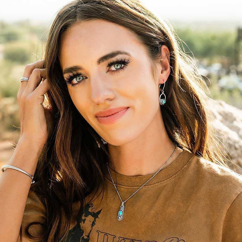 
                  
                    Woman Wearing Montana Silversmiths Treasured Embrace Turquoise Earrings
                  
                