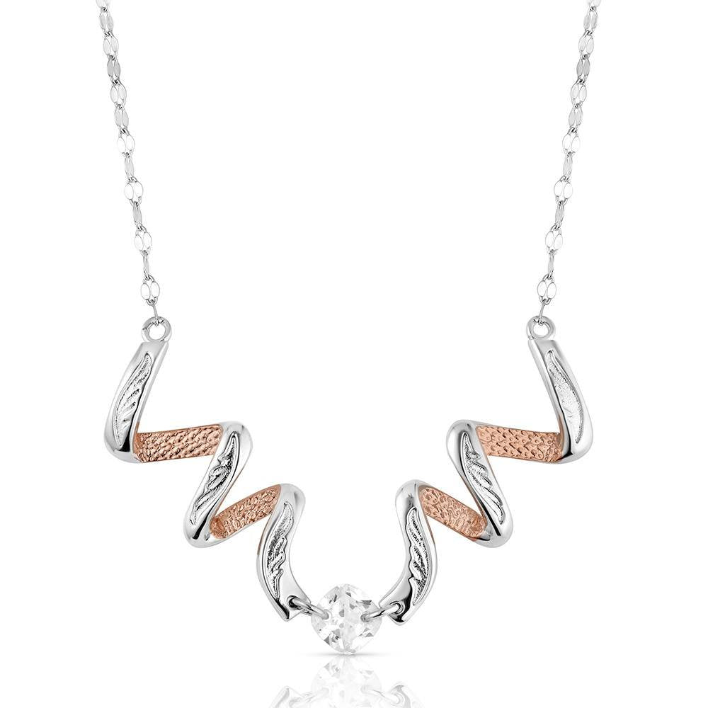 Montana Silversmiths Buckaroo Bling Necklace featuring a two-tone Western pendant with sparkling crystals and polished silver and gold-tone accents.