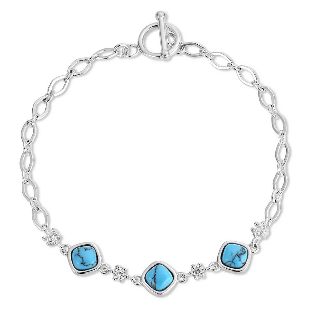 Montana Silversmiths Canyon Serenade Turquoise Bracelet featuring crafted turquoise, sparkling crystal accents, and a Western toggle clasp.