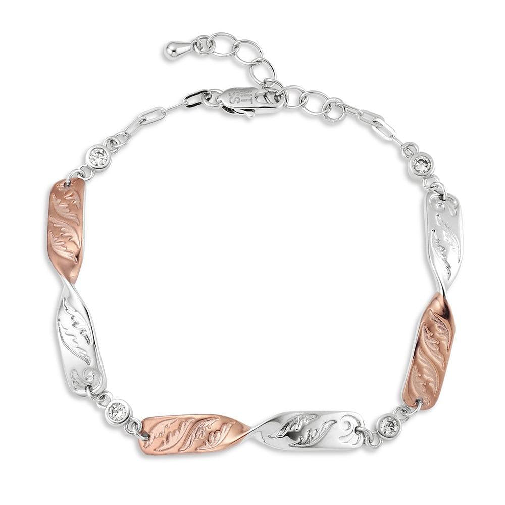 Montana Silversmiths Flatland Twister Bracelet featuring a two-tone silver and gold design with sparkling crystal accents and an adjustable chain.