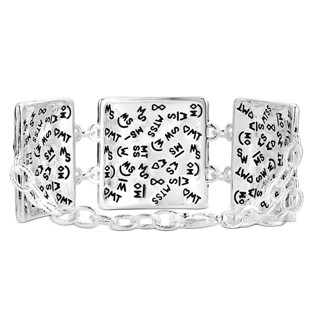 Two-tone Montana Silversmiths Western bracelet with engraved floral silver and rose gold accents