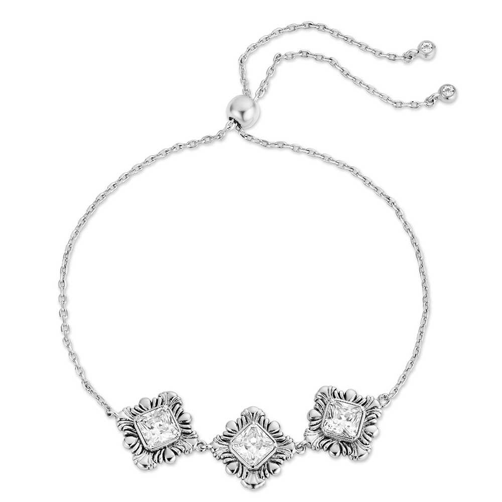 Montana Silversmiths Square Dance Bracelet featuring sparkling crystal floral accents and an adjustable bolo closure in polished silver.