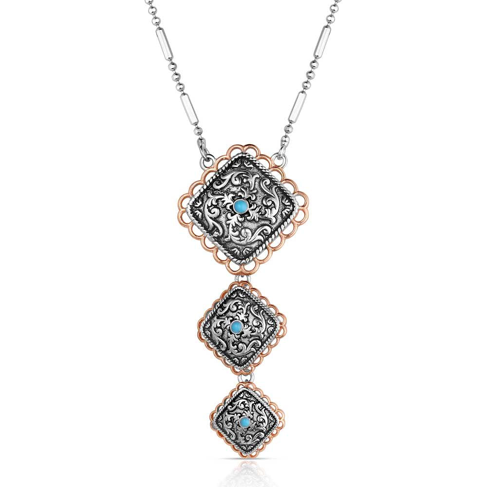 Montana Silversmiths Western Ember Necklace featuring a crafted turquoise two-tone pendant with polished silver and gold-tone Western styling.