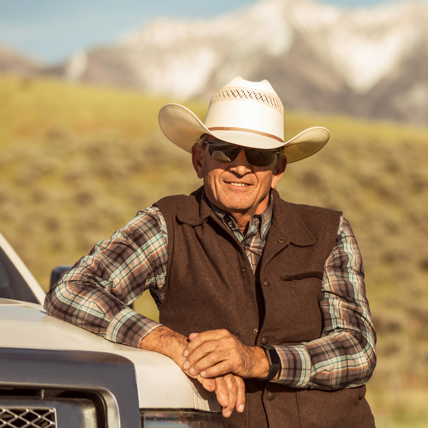 Cowboy posing by truck